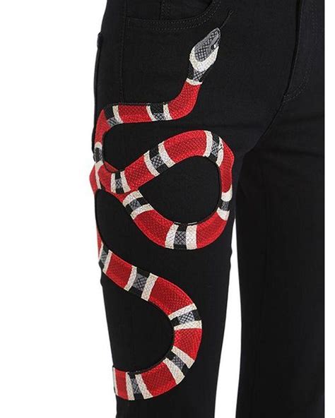 gucci gucci snake embroidered jeans